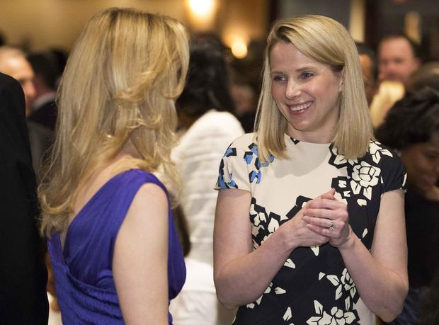 Yahoo Chief Executive Officer Marissa Meyer, right, speaks with a guest at the White House Correspondents' Association dinner in Washington May 3, 2014. 