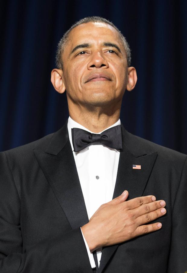 President Obama stands during the posting of colors at the White House Correspondents' Association dinner in Washington May 3, 2014. 
