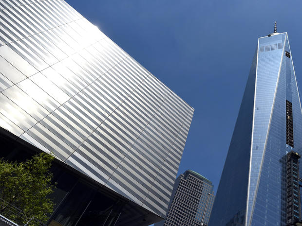 The National September 11 Memorial & Museum is seen next to One World Trade Center during a media tour May 13, 2014. 