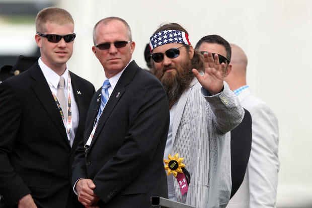 Reality TV star Willie Robertson waves to fans before the 139th Preakness Stakes at Pimlico Race Course in Baltimore May 17, 2014. 