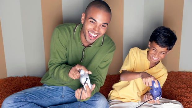 father kid Play A Video Game With Him thinkstock 