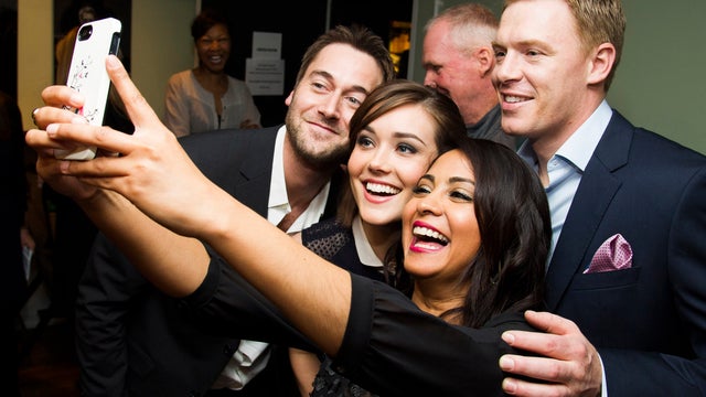 Ryan Eggold, from left, Megan Boone, Parminder Nagra and Diego Klattenhoff pose for a selfie at the Television Academy Presents an Evening with "The Blacklist" April 2, 2014, in New York. 
