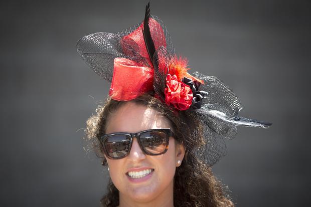 Victoria Garofalo poses for a portrait with her colorful hat before the 146th running of the 2014 Belmont Stakes in Elmont, New York, June 7, 2014. 