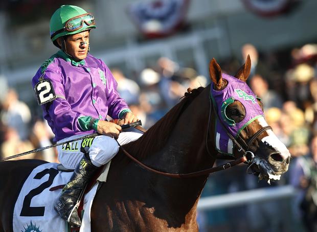 Jockey Victor Espinoza sits atop California Chrome after coming in fourth at the 146th running of the 2014 Belmont Stakes in Elmont, New York, June 7, 2014.  California Chrome failed to win the coveted Triple Crown. 