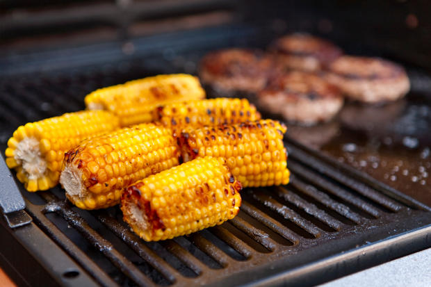 Sweetcorn cooking on a barbecue bbq 