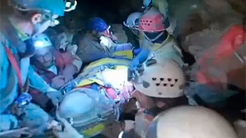 Rescuers help injured researcher Johann Westhauser inside the Riesending cave in Untersberg, south of Munich  