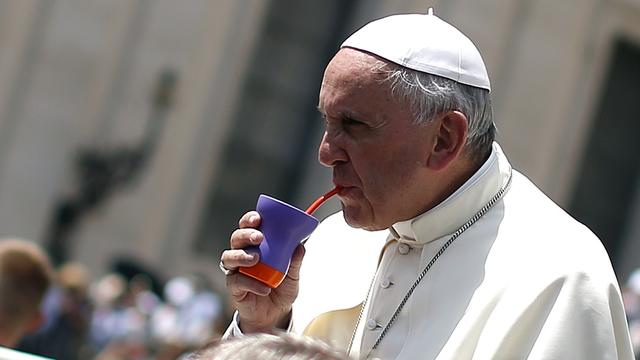 Pope Francis drinks mate, an Argentinian drink, during his weekly general audience at St. Peter's Square 