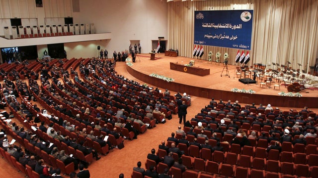 Members of the newly elected Iraqi parliament attend a session at the Parliament headquarters in Baghdad 
