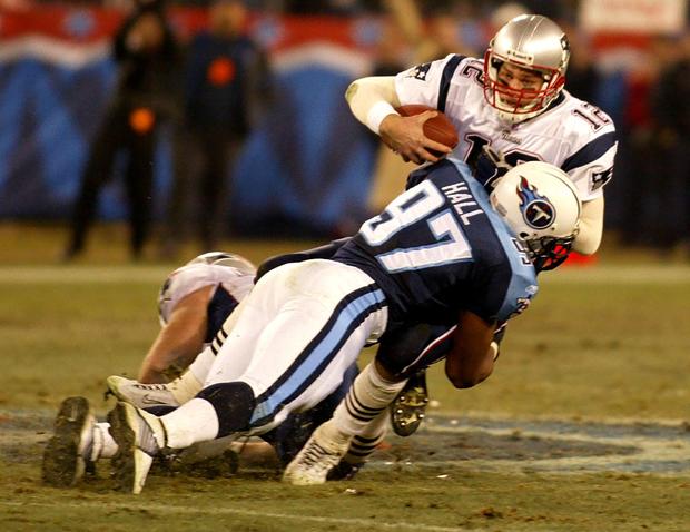 New England Patriots quarterback Tom Bradey (R) is 