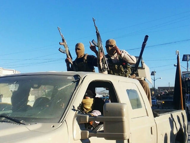 Militants from the Islamic State of Iraq and Syria celebrate the group's declaration of an "Islamic State," in Fallujah 