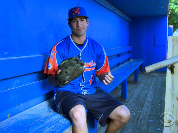 Ryan Perez displays his his six-fingered baseball glove. 