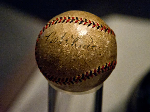A baseball autographed by legendary play 
