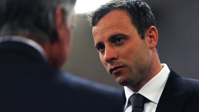 South African Olympic and Paralympic sprinter Oscar Pistorius arrives in court for the closing arguments of his trial 