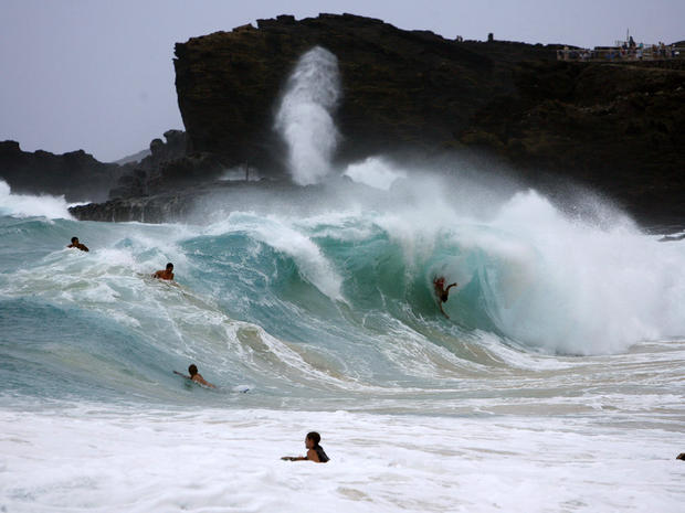 Bodysurfers and boogie boarders catch waves at Sandy Beach on the east side of Oahu as Tropical Storm Iselle passes through the Hawaiian islands in Honolulu, Hawaii, Aug. 8, 2014. 