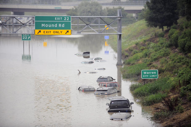 Cars are stranded along a flooded stretch of I-696 at the Warren, Mich., city limits Aug. 12, 2014. 