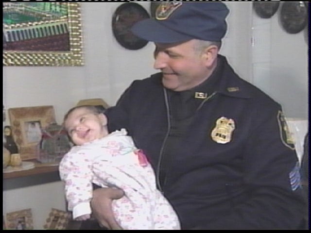 New York police officer Joseph Barca attends wedding of woman he saved -  CBS News