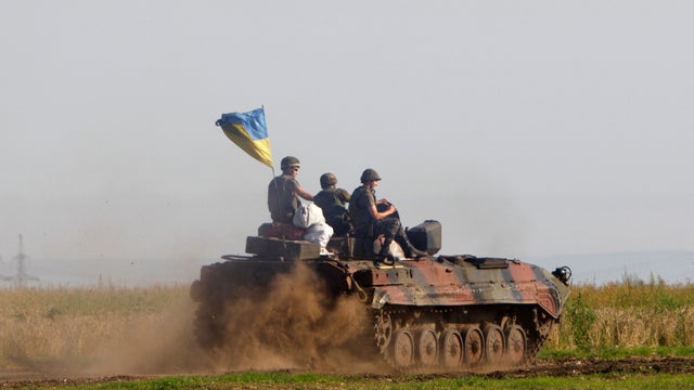 Ukrainian troops patrol an area in the Luhansk region 