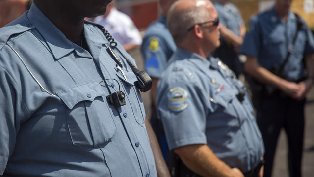 Members of Ferguson Police Department wearing what appear to be body cameras during rally on August 30, 2014 in Ferguson, Missouri over shooting death on August 9, 2014 of unarmed black teenager. Michael Brown by white Ferguson police officer 