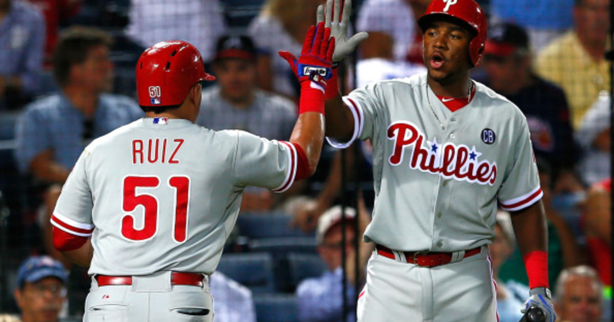 Revere hits rare homer as Phillies beat Nationals in 11