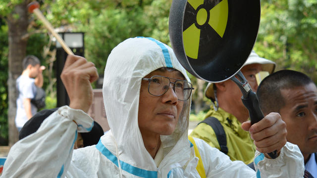 An anti-nuclear demonstrator protests in front of the Nuclear Regulatory Authority (NRA) in Tokyo 