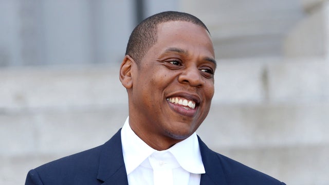 Recording artist Shawn "Jay-Z" Carter makes an announcement on the steps of City Hall in downtown Los Angeles April 16, 2014, in Los Angeles, California. 