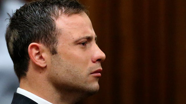 Olympic and Paralympic track star Oscar Pistorius listens to the verdict in his trial 