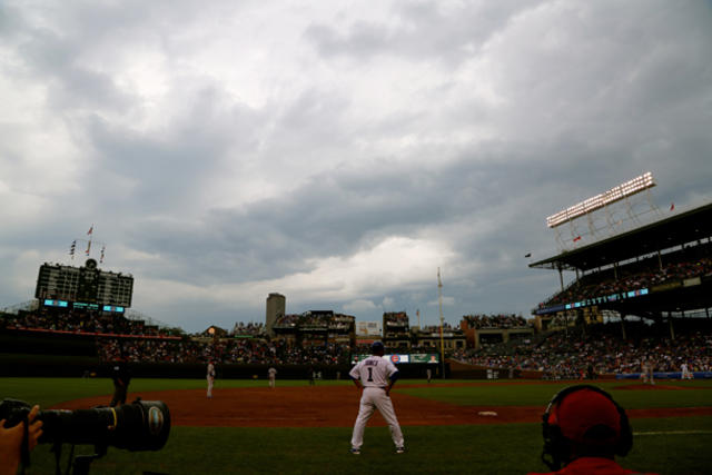 Fans gather in front of Wrigley Field before the ballpark's 100th