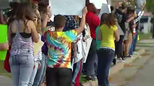  Students outside Arvada High School in Arvada, Colorado, a Denver suburb, after walking out of class to protest a history curriculum proposal from the area's conservative school board 