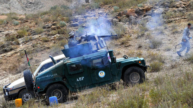 Afghan security personnel fight Taliban insurgents during an operation in Dur Baba district, Nangarhar province 