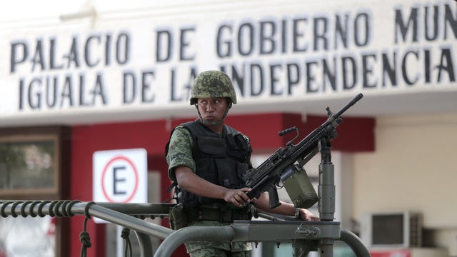 A Mexican soldier patrols in downtown Iguala, Guerrero state, Mexico 