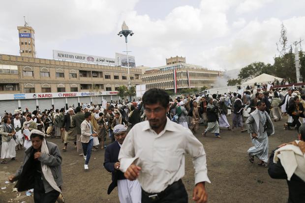 People flee after a suicide attack in Sanaa 