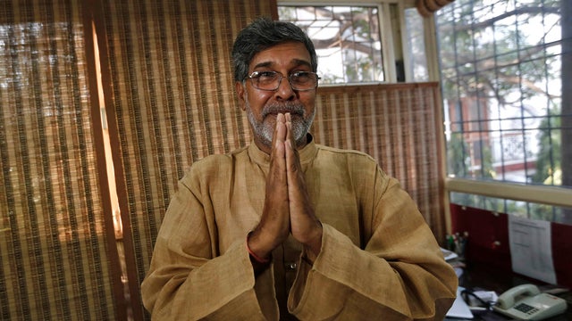Indian children's rights activist Kailash Satyarthi gestures as he speaks with the media at his office in New Delhi 