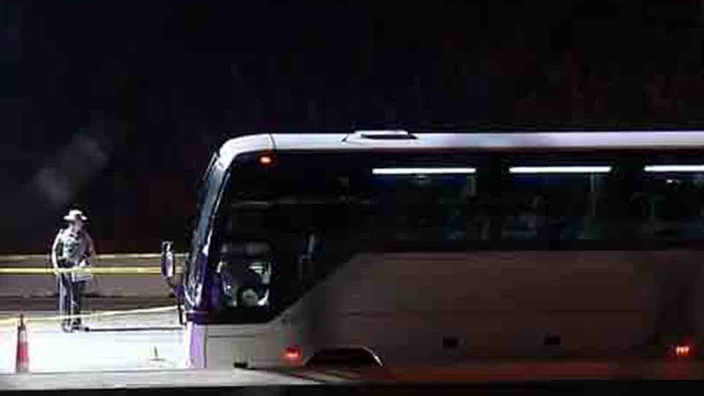 ​A bus on which a man was fatally shot by a Connecticut state police officer sits on Interstate 95 in Norwalk 