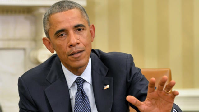 ​President Obama speaks to the media about the fight against the Ebola virus during a meeting with his Ebola response team in the Oval Office at the White House Oct. 16, 2014, in Washington. 