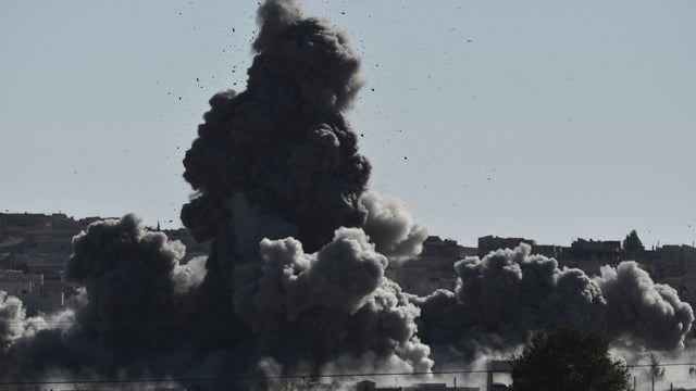 Smoke rises after an airstrike in the city of Kobane, also known as Ain al-Arab, as it seens from the southeastern border village of Mursitpinar, Sanliurfa province. 