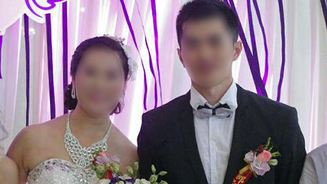 "Hong" and "Ben" are seen in a photo from their wedding in Beijing 