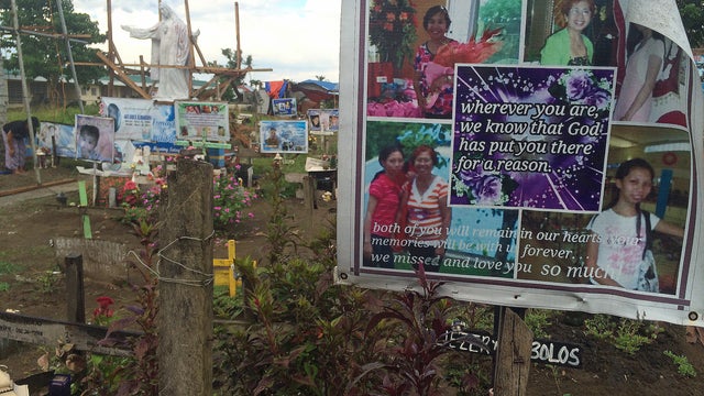 A memorial to victims of Typhoon Haiyan is seen at a mass grave in Palo, Leyte Province 