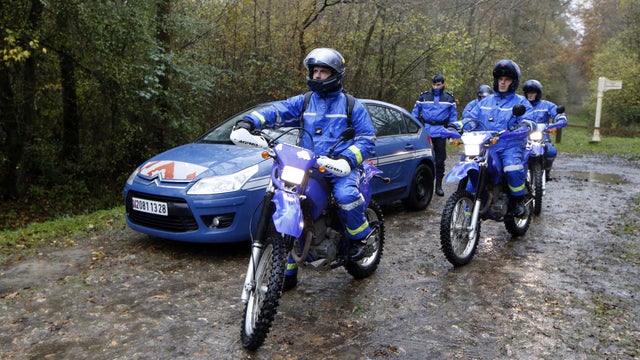 French gendarmes take part in the ongoing search for what was first described as a tiger on the loose 