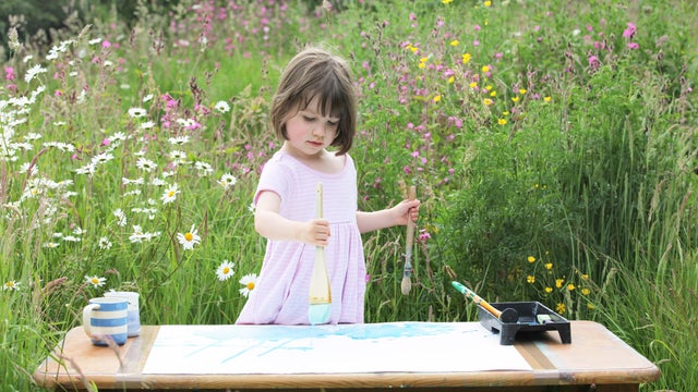 Iris Grace Halmshaw paints in her garden 