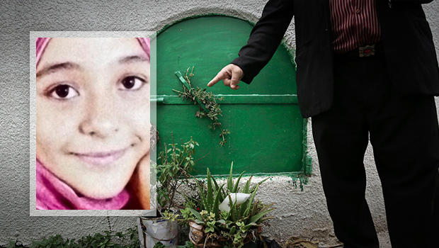 ​A man stands Nov. 5, 2014, in front of the grave of 13-year-old Suheir El-Batea, inset, who died undergoing the procedure of female genital mutilation performed by Dr. Raslan Fadl, in Dierb Biqtaris village, on the outskirts of the town of Aga in Dakahli 