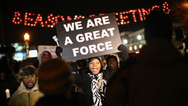 Demonstrators protest the shooting death of Michael Brown near a police station Nov. 21, 2014, in Ferguson, Missouri. 