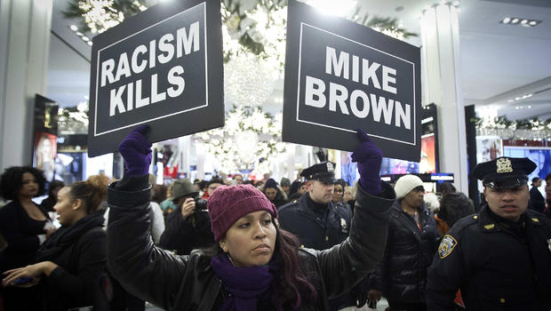 A protester marches though Macy's flagship store in New York City in support of the late Michael Brown Nov. 28, 2014. The unarmed 18-year-old was shot to death in Ferguson, Missouri, by police officer Darren Wilson. 