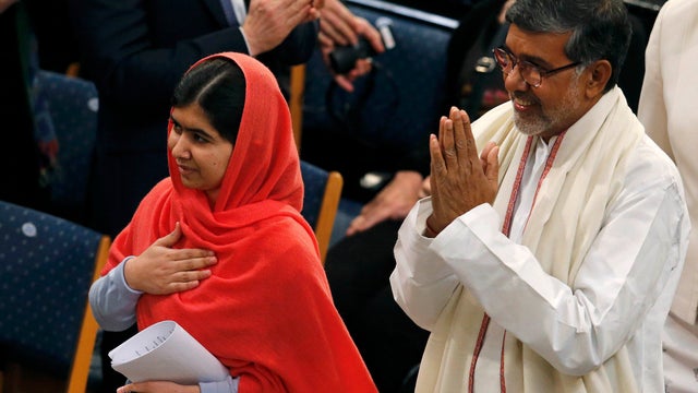 Nobel Peace Prize laureates Malala Yousafzai (L) and Kailash Satyarthi arrive for the Nobel Peace Prize awards ceremony 