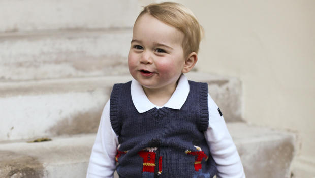 Prince George is seen in late November 2014 in one of three official Christmas images showing him in a courtyard at Kensington Palace in central London. 