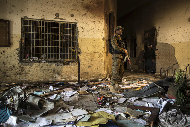 Soldier stands inside Army Public School, which was attacked by Taliban gunmen, in Peshawar, on December 17, 2014 