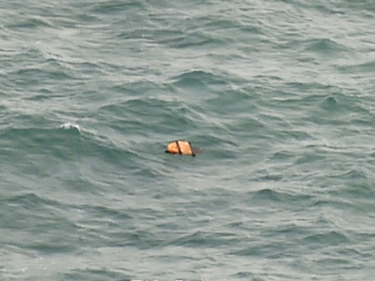 AirAsia Flight 8501 searchers find bodies, debris from plane - CBS News
