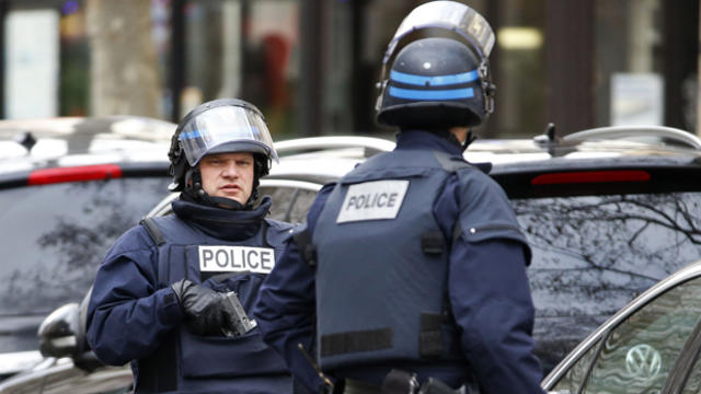 French intervention police secure the area near a synagogue after a false report of shots being fired, later learned to be firecrackers, in Paris Jan. 10, 2015. 