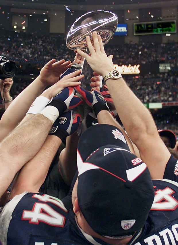New England Patriots' players hoist the Vince Lomb 
