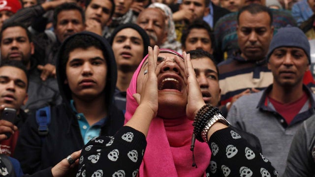 An anti-government protester chants slogans during a protest in front of the journalists' syndicate in Cairo 