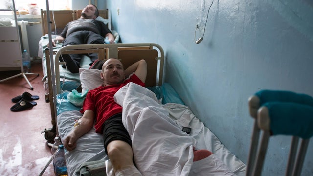 People wounded as a result of shelling in southern Ukrainian city of Mariupol on Jan. 24 are in the emergency hospital for treatment on Jan. 26, 2015. 
